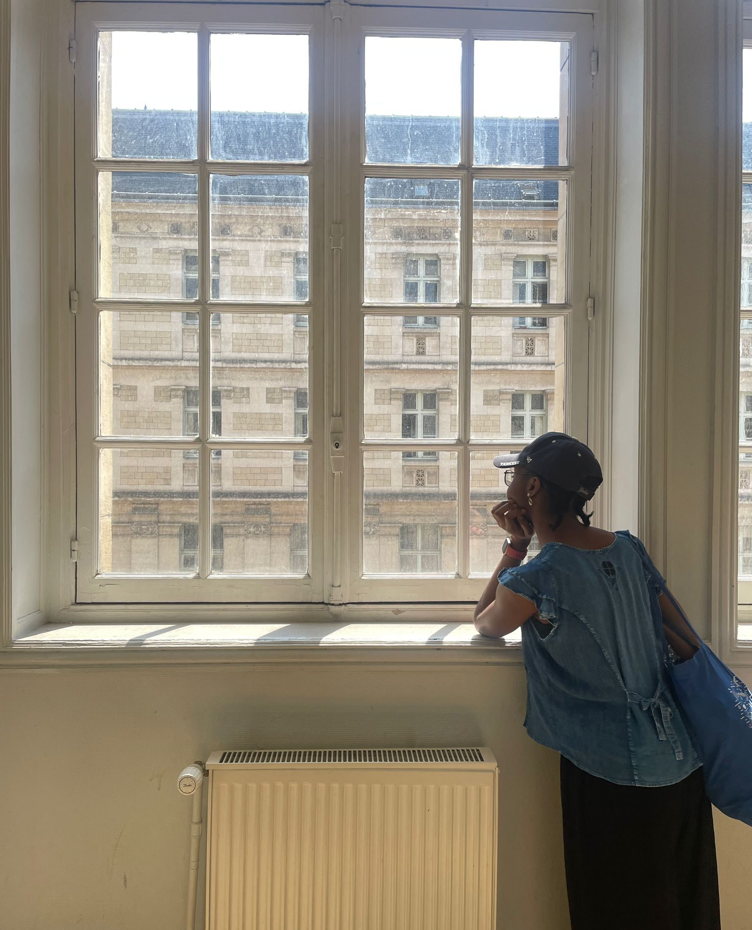 Tami taking a last look out the window at La Sorbonne.