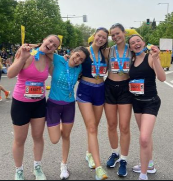 Kate with friends at the end of a half-marathon