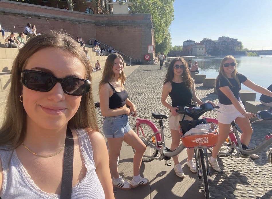 My friends and I cycling around Toulouse on the city bikes